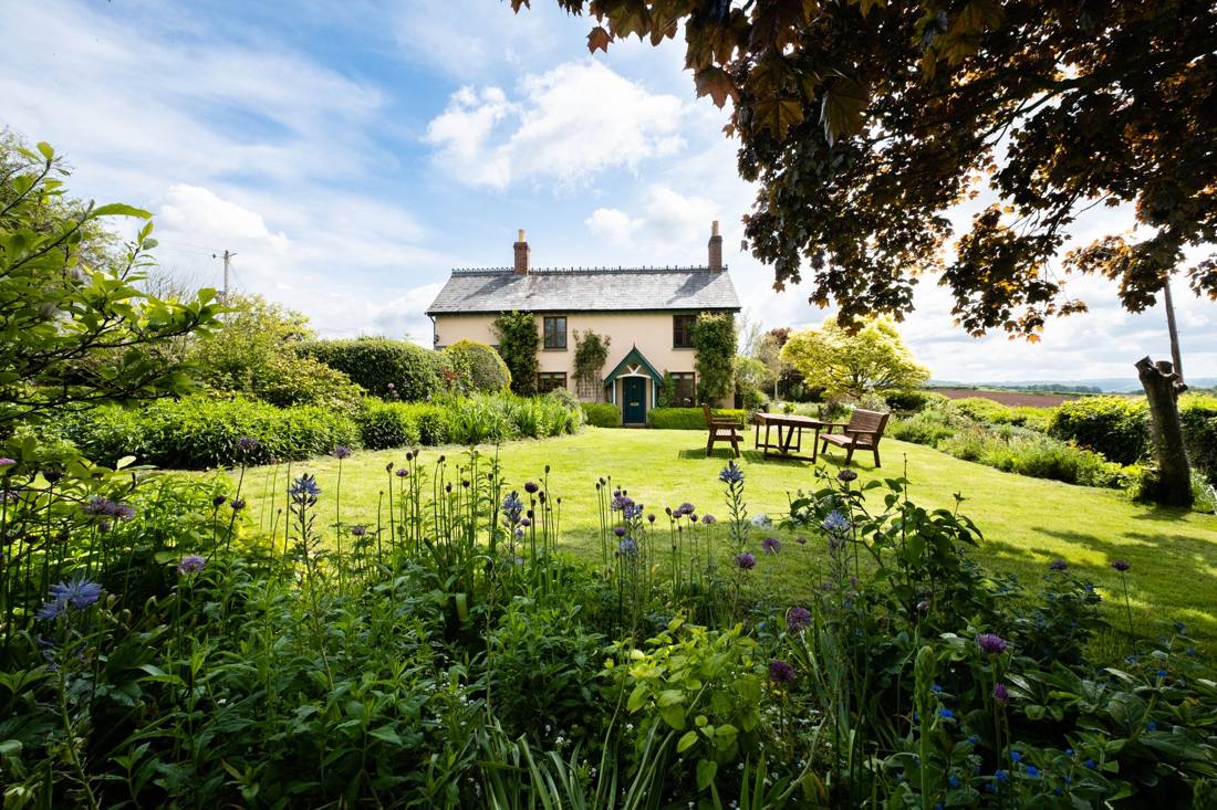 Serene countryside view of a traditional house in Hereford, England.